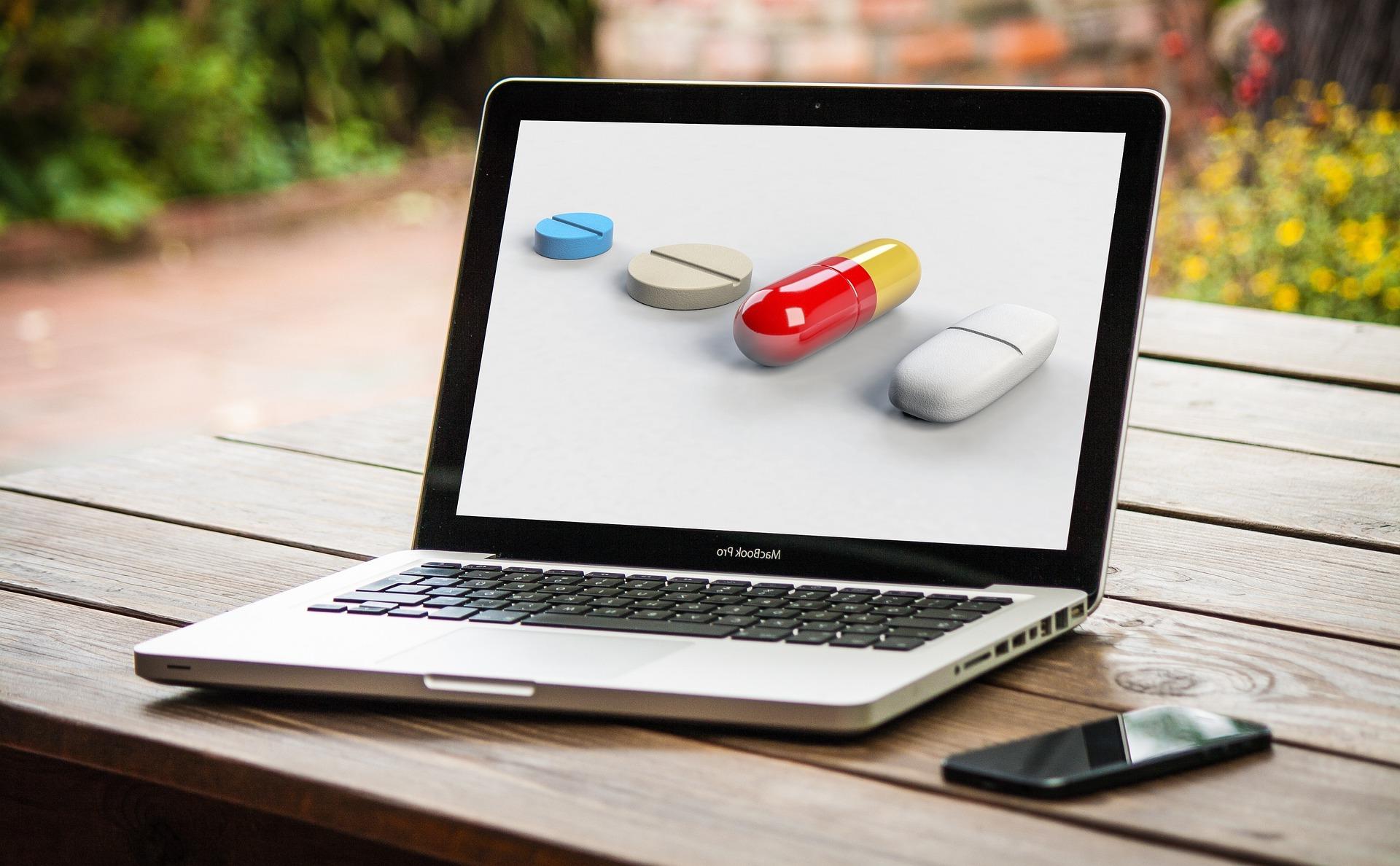 A laptop displaying a variety of pills